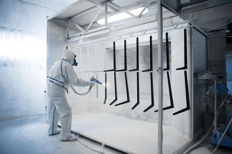 Applying intumescent fire coating in a controlled spray booth environment